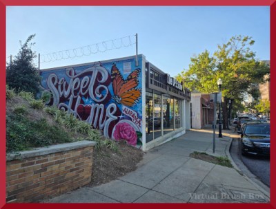 Photo of UPS storefront with mural painted on the side