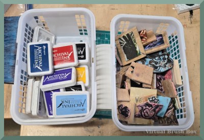 photo of a basket of ink pads and a basket of stamps
