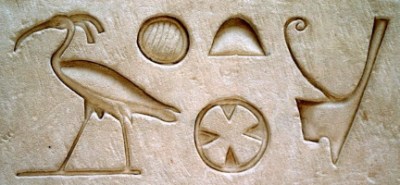 photo of hieroglyphs carved in stone