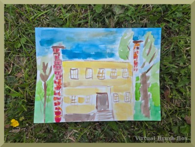 photo of watercolor painting lying on grass, subject is two-story yellow house with porch