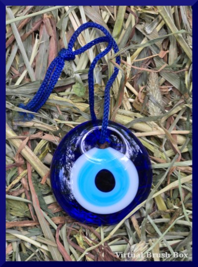 Photo of a blue, white, and light blue bead