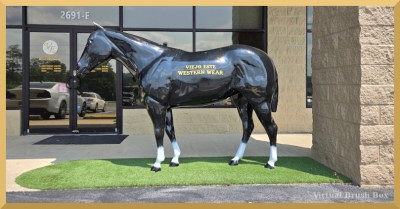 photo of horse statue in front of building, Viejo Este Western Wear is painted on the side of the horse