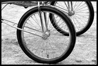 black and white photo of the wheels of a jog cart