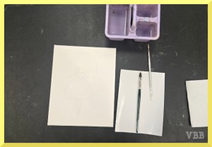 photo of a tabletop with art supplies