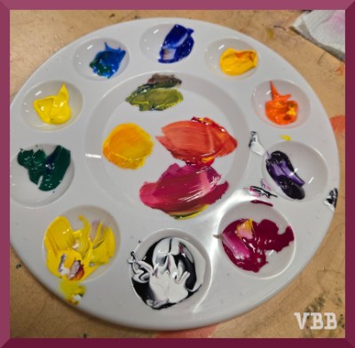 photo of plastic palette tray filled with paints