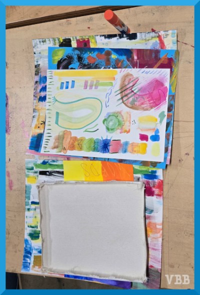 Photo of two piles of drawings on a table