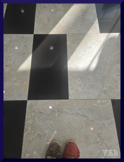 photo of feet on a black & white tile floor