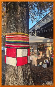 photo of crocheted squares hanging on a tree