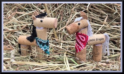 Photo of two horses with cork bodies and decorated features