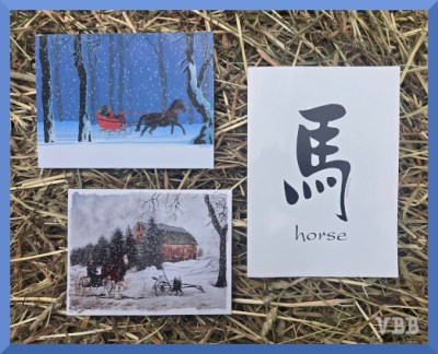 Photo of three greeting cards on a hay bale