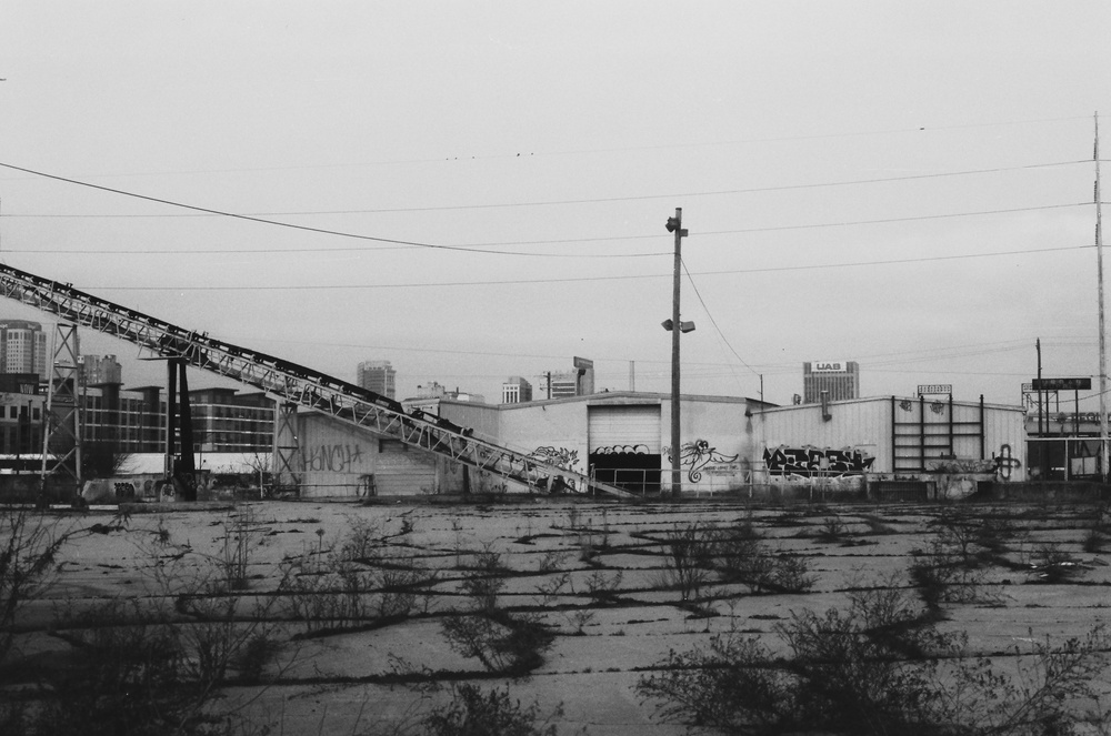 Black and white photo of an old industrial park.