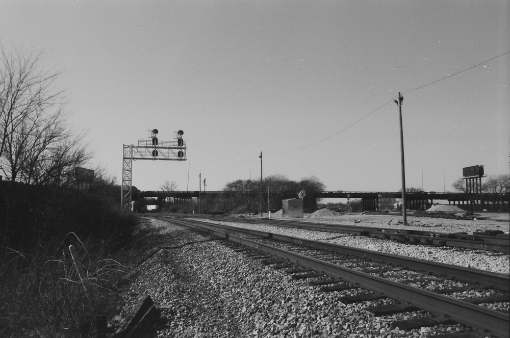 Black and white photo of train tracks.
