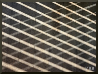 Photo of a porch railing on a wooden floor