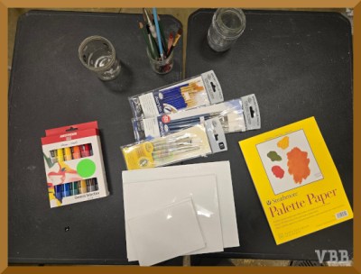 Photo of a table holding art supplies.