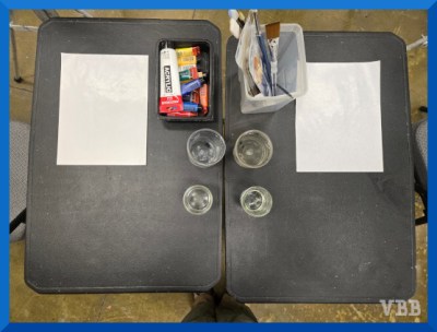 Photo of a table with neat art supplies.