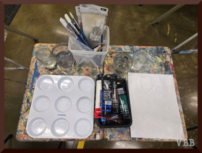 Photo of tables with neat art supplies.