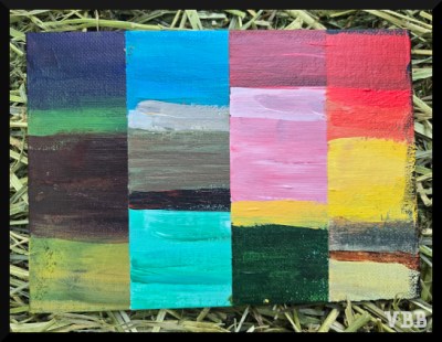 Photo of a small painting of multi-colored vertical stripes